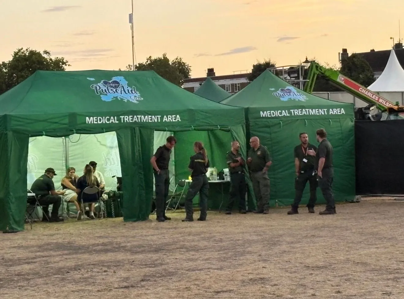 PulseAid medical team beside marked medical treatment gazebos at a live event